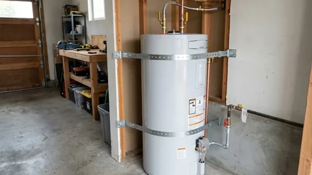 Tank water heater strapped to the wall of a garage